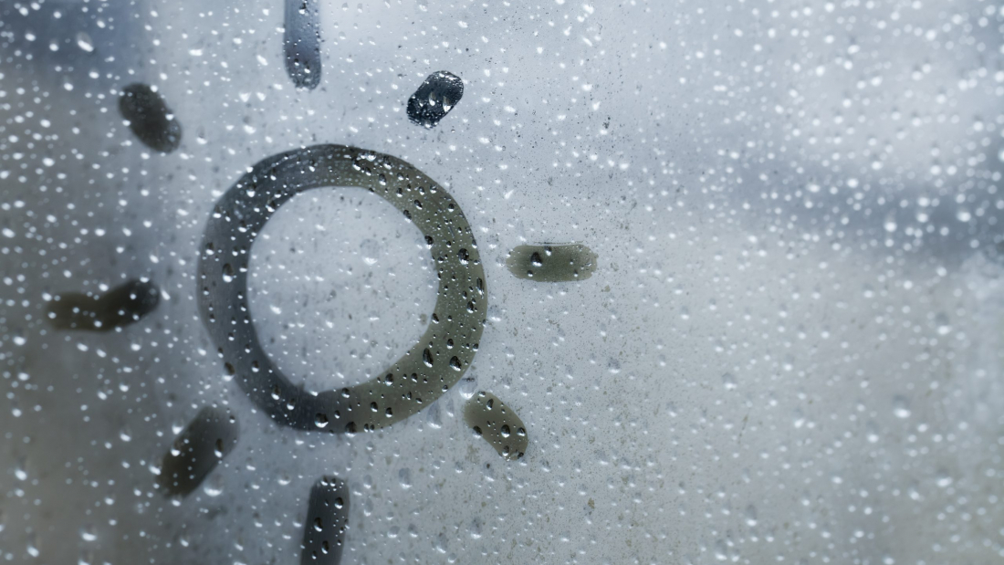 Sun Shape on window glass, it´s raining outside